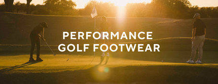 Golfer walking down the fairway wearing white SQAIRZ golf shoes.